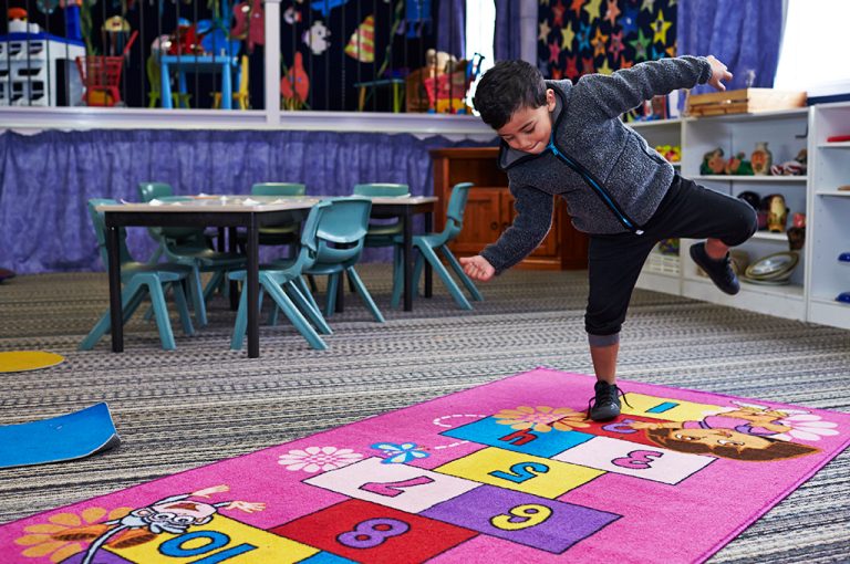 Boy Playing Hopscotch Activity